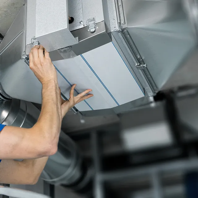Ventilation system installation and repair service. hvac technician at work. banner copy space stock photo