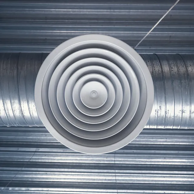 Ventilation and air conditioning shafts on the ceiling in the building stock photo